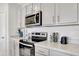 Modern kitchen with stainless steel appliances at 1117 Star Ruby Ln, Winter Haven, FL 33880