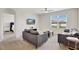 Living room with gray sofas and a view to a bedroom at 1117 Star Ruby Ln, Winter Haven, FL 33880