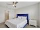 Spacious bedroom with a plush velvet headboard and ensuite bathroom access at 1117 Star Ruby Ln, Winter Haven, FL 33880