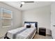 Bedroom with a queen bed, ceiling fan, and window with blinds at 1117 Star Ruby Ln, Winter Haven, FL 33880
