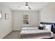 Bedroom with a queen bed, ceiling fan, and window with blinds at 1117 Star Ruby Ln, Winter Haven, FL 33880