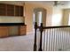 Loft area with built-in wooden desk and cabinets at 13910 Dove Wing Ct, Orlando, FL 32828