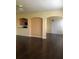 Spacious living area with dark hardwood floors and archways at 13910 Dove Wing Ct, Orlando, FL 32828