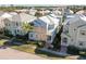 Aerial view showcasing a light blue house among other homes in a community at 1474 Fairview Cir, Kissimmee, FL 34747