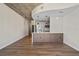 Open concept living area with modern kitchen and breakfast bar at 155 S Court Ave # 1912, Orlando, FL 32801