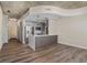 Open concept living area with modern kitchen and breakfast bar at 155 S Court Ave # 1912, Orlando, FL 32801