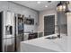 Modern kitchen with stainless steel appliances and a marble island at 155 S Court Ave # 1912, Orlando, FL 32801