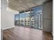 Spacious living room with hardwood floors and floor-to-ceiling windows at 155 S Court Ave # 1912, Orlando, FL 32801