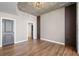 Bedroom with hardwood floors and gray accent wall at 155 S Court Ave # 1912, Orlando, FL 32801