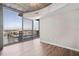 Spacious living area featuring hardwood floors and large windows at 155 S Court Ave # 1912, Orlando, FL 32801