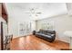 Spacious Gathering room featuring tile floors, a ceiling fan, and sliding glass doors leading to the backyard at 2913 Elbib Dr, Saint Cloud, FL 34772