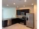Modern kitchen with stainless steel appliances and granite countertops at 4778 Sparkling Shell Ave, Kissimmee, FL 34746