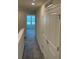 Upper level hallway with bedroom and closet access at 4778 Sparkling Shell Ave, Kissimmee, FL 34746
