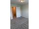 Bright bedroom featuring neutral walls and carpeting, with access to upper floor at 4778 Sparkling Shell Ave, Kissimmee, FL 34746