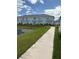 A paved walkway winds through the community, offering scenic pond views at 4778 Sparkling Shell Ave, Kissimmee, FL 34746