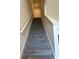 Carpeted staircase leading to the upper level of the home at 4778 Sparkling Shell Ave, Kissimmee, FL 34746