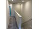 Upstairs hallway with carpet and access to bedrooms at 4778 Sparkling Shell Ave, Kissimmee, FL 34746