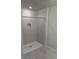 Shower stall with tile surround and a built-in seat at 4778 Sparkling Shell Ave, Kissimmee, FL 34746