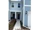 Front entry of townhouse with walkway and landscaping at 4778 Sparkling Shell Ave, Kissimmee, FL 34746