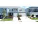 Two-story townhouse exterior, two-car garage, and front landscaping at 4778 Sparkling Shell Ave, Kissimmee, FL 34746