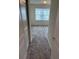 Bedroom with carpet, large window, and closet at 4778 Sparkling Shell Ave, Kissimmee, FL 34746