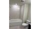 Bathroom with a shower/tub combo and tile flooring at 4778 Sparkling Shell Ave, Kissimmee, FL 34746