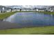 Expansive pond in the center of the townhome community at 4778 Sparkling Shell Ave, Kissimmee, FL 34746