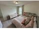 Serene bedroom with a double bed, dresser, and bookshelf at 15121 Pigeon Plum Ln, Winter Garden, FL 34787