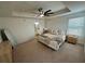 Main bedroom with carpeted floor, ceiling fan, and ensuite bathroom at 15121 Pigeon Plum Ln, Winter Garden, FL 34787