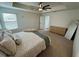 Main bedroom with a king-size bed and ample closet space at 15121 Pigeon Plum Ln, Winter Garden, FL 34787