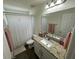 Well-appointed bathroom with granite countertop and shower/tub combo at 15121 Pigeon Plum Ln, Winter Garden, FL 34787
