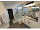 Modern bathroom with walk-in shower, granite countertop, and large closet at 15121 Pigeon Plum Ln, Winter Garden, FL 34787