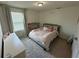 Cozy bedroom with a double bed and built in shelving at 15121 Pigeon Plum Ln, Winter Garden, FL 34787