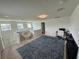 Bright bonus room featuring a cozy seating area and home office space at 15121 Pigeon Plum Ln, Winter Garden, FL 34787