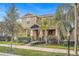 Two-story house with a front porch, landscaping, and mailbox at 15121 Pigeon Plum Ln, Winter Garden, FL 34787