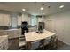 Spacious kitchen with island, stainless steel appliances, and white cabinets at 15121 Pigeon Plum Ln, Winter Garden, FL 34787