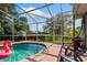 Large screened pool with lake view at 1533 Findlay St, Deltona, FL 32725