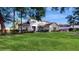 Two-story house with a large front yard and mature trees at 201 Capri Cove Pl, Sanford, FL 32771