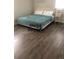 Primary bedroom with neutral color scheme and laminate wood floors at 280 Westwood Ave, Winter Haven, FL 33880