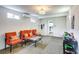 Finished playroom with orange couches and toys at 280 Westwood Ave, Winter Haven, FL 33880