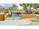 Cute cottage with a pergola and wooden fence at 280 Westwood Ave, Winter Haven, FL 33880