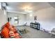 Finished basement with orange couches and a play area at 280 Westwood Ave, Winter Haven, FL 33880