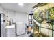 Laundry room with washer, dryer, and storage shelves at 280 Westwood Ave, Winter Haven, FL 33880