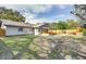 Spacious backyard with covered patio and wooden bar at 280 Westwood Ave, Winter Haven, FL 33880