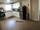 Modern kitchen with stainless steel appliances and white cabinets at 280 Westwood Ave, Winter Haven, FL 33880