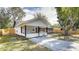 Charming one-story home with a covered porch and well-maintained yard at 280 Westwood Ave, Winter Haven, FL 33880