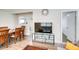 Bright living room features a sofa, coffee table, and large TV at 280 Westwood Ave, Winter Haven, FL 33880