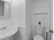 Small half bathroom with white pedestal sink and toilet at 3390 Cedar Spring Pl # 163, Winter Park, FL 32792