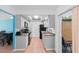 Compact kitchen with gray cabinets and black appliances at 3390 Cedar Spring Pl # 163, Winter Park, FL 32792