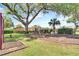 Community playground nestled under large oak tree at 3390 Cedar Spring Pl # 163, Winter Park, FL 32792